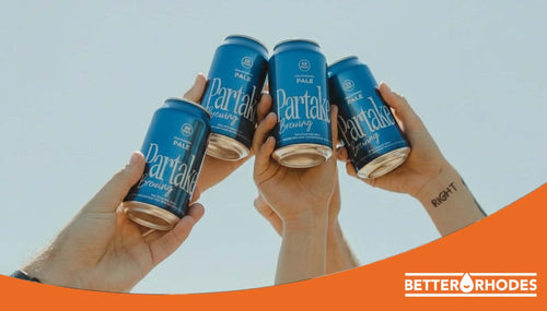 Friends toasting with Partake non-alcoholic beer during Dry January