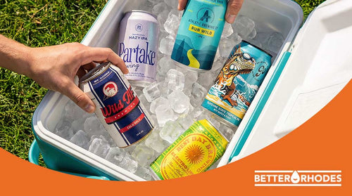 Cooler stocked with non-alcoholic beer brands including Athletic Brewing, Partake, Wild AF, Best Day Brewing, and Go Brewing