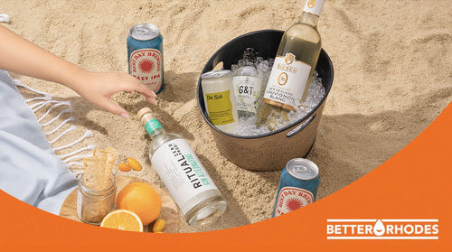 Top five non-alcoholic drinks for summer hosting chilled in a cooler on sand