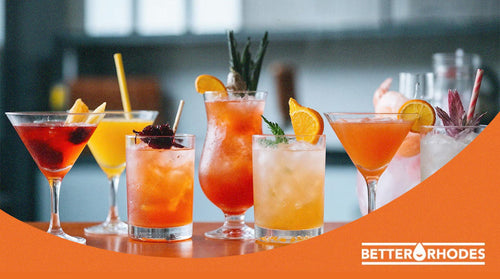 A vibrant lineup of alcohol-free cocktails in various glassware garnished with citrus and fruit