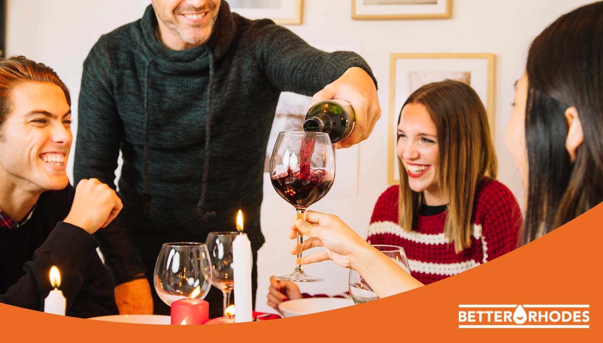 Friends enjoying non-alcoholic wine together at a dinner gathering