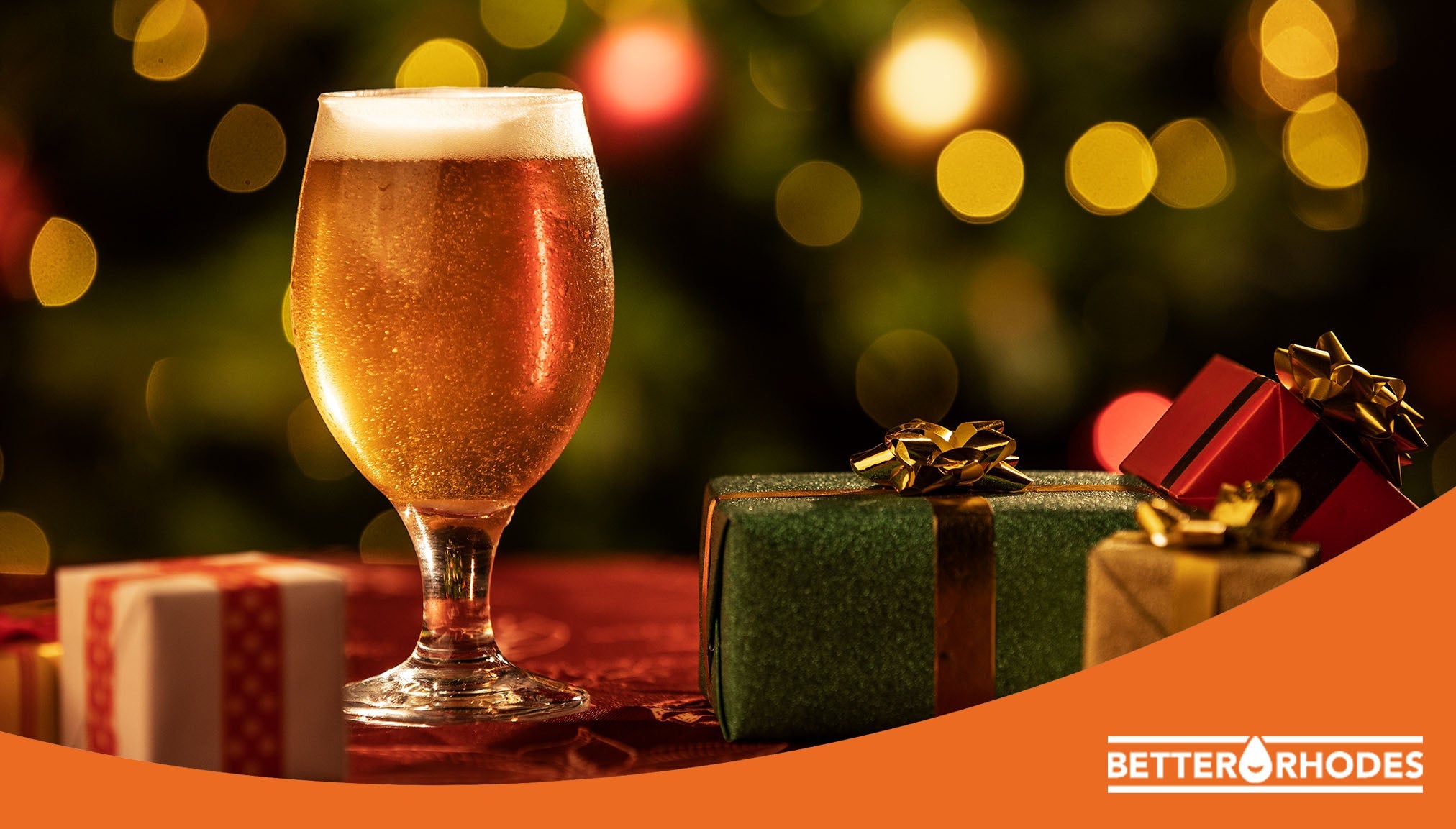 Non-alcoholic beer in a holiday setting with festive gifts and warm lights