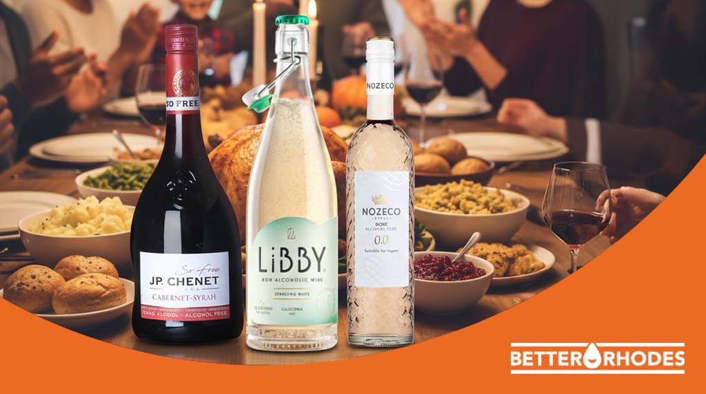 Non-alcoholic red, white, and rosé wines displayed on a Thanksgiving dinner table