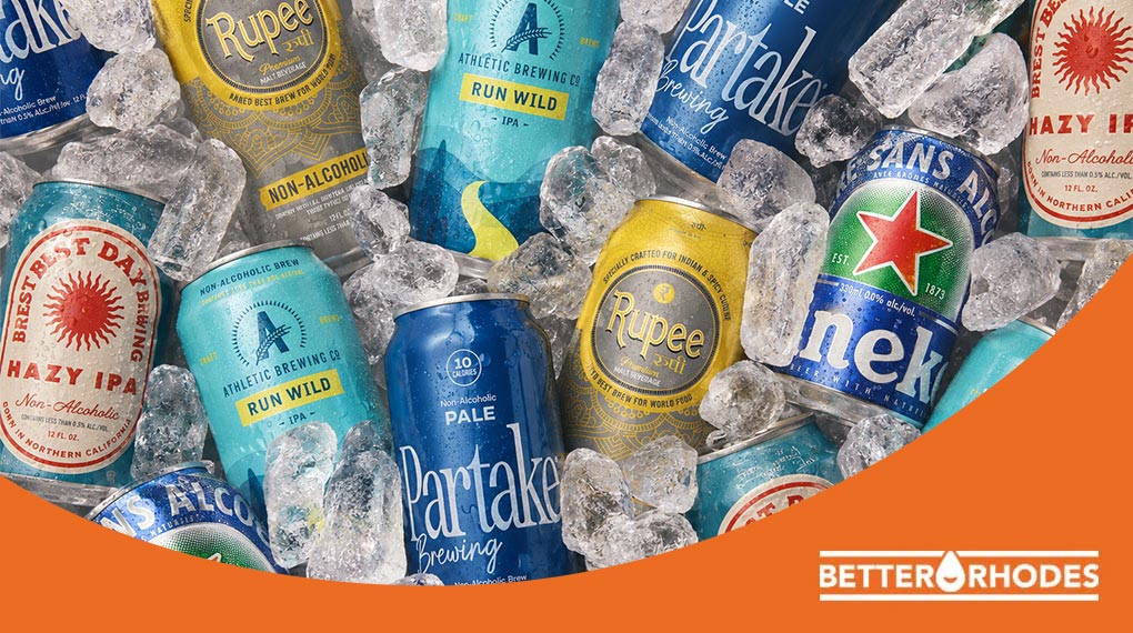 Non-alcoholic beer cans including Rupee, Athletic Run Wild IPA, Partake Pale, Best Day Hazy IPA, and Heineken 0.0 on ice