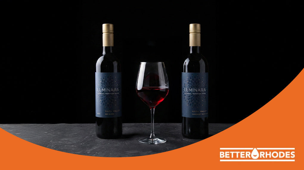 Two bottles of Luminara Napa Valley non-alcoholic red wine with a filled glass
