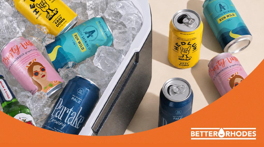 Assorted non-alcoholic beers on ice in a cooler including Athletic Brewing, Hedlum, Busty Lush, and Partake