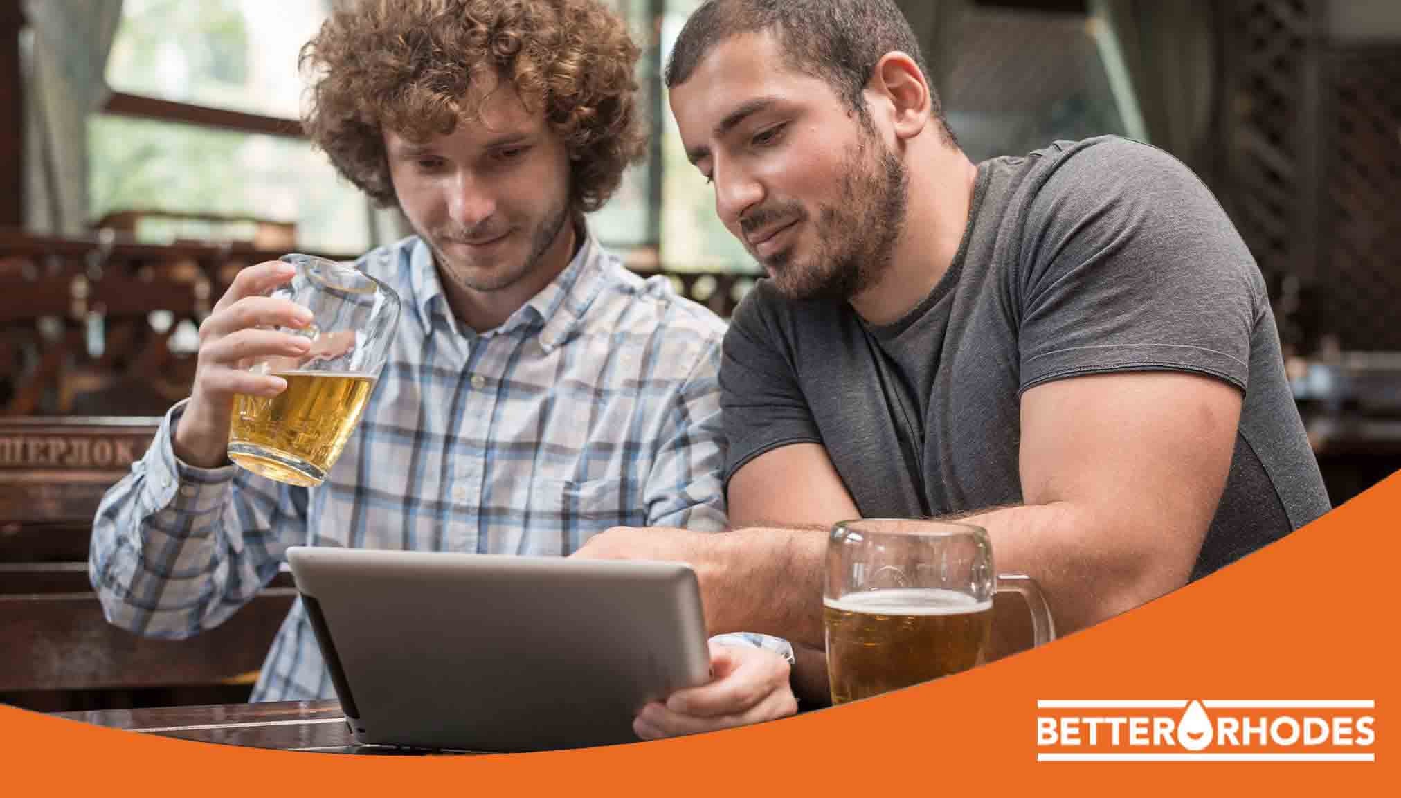 Friends comparing non-alcoholic beers online