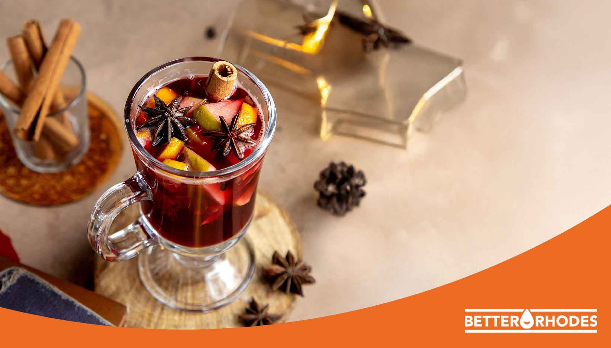 Glass of non-alcoholic mulled wine with cinnamon, star anise, and citrus for a cozy holiday drink